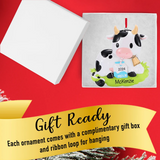 Add a festive touch with a personalized Christmas ornament featuring a cow from Gift Shopie.