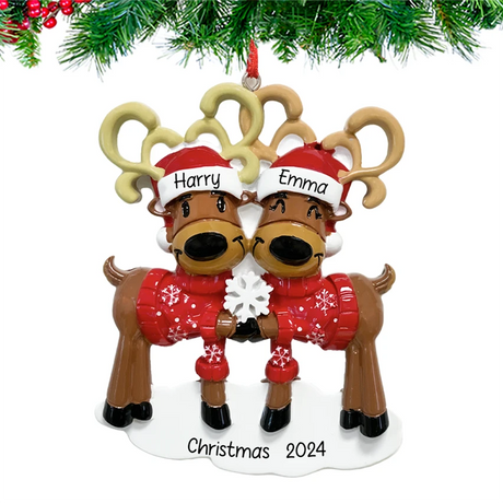 Celebrate love this holiday season with a personalized Christmas ornament featuring a reindeer couple.