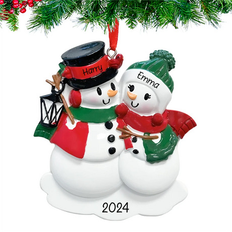 Celebrate your first Christmas together with a personalized snowman lantern couple ornament.